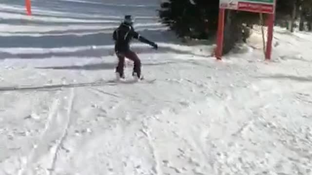 Skier in black skier in grey crash into each other