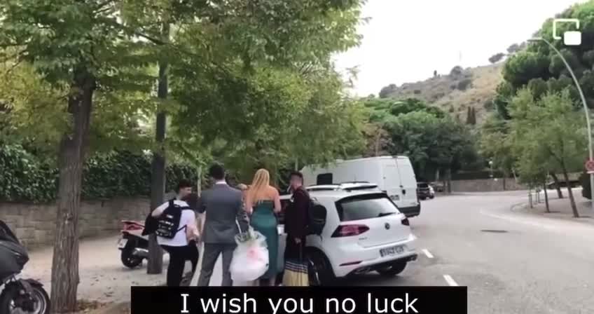 A newlywed couple, leaving the Russian consulate in Barcelona where they registered their marriage