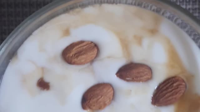 Korean egg scramble and plain yogurt breakfast with almonds.