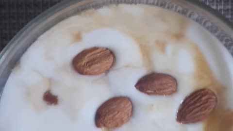 Korean egg scramble and plain yogurt breakfast with almonds.