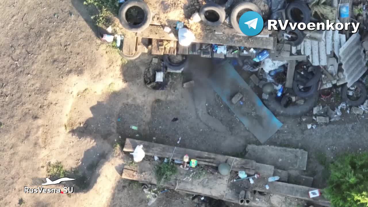 Ukraine War - Russian Quadcopter dropping grenade on Ukrainian position