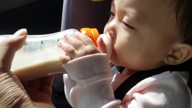 The baby angel is drinking milk