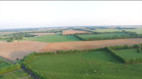 Open field of farmland fly over
