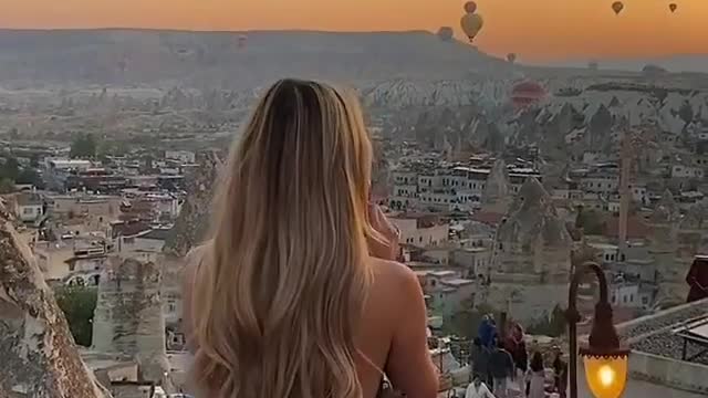 Why are there so many hot air balloons in the sky above this city?