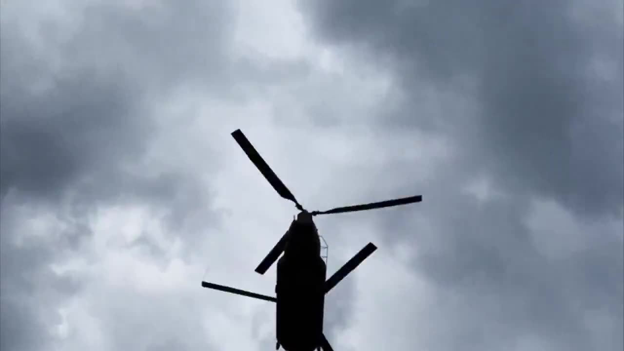 A National Guard Chinook helicopter's low landing at a relief camp in ...