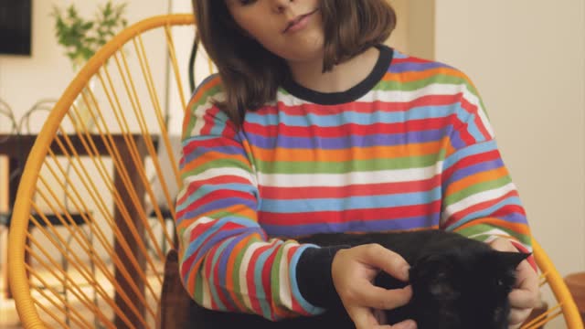 Woman petting a cat