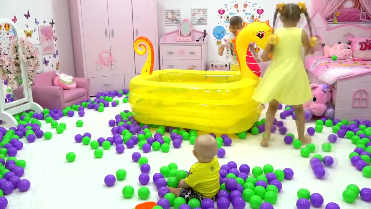 Cute childern are playing with toys