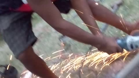 Cutting Fence Post in Port Moresby, Papua New Guinea