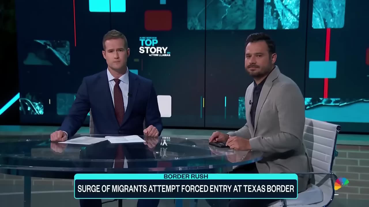 Migrants forcing their way across US border