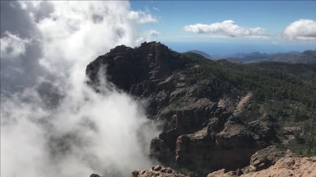 clouds around pico de las nieves the highest peak of the island of gran canaria