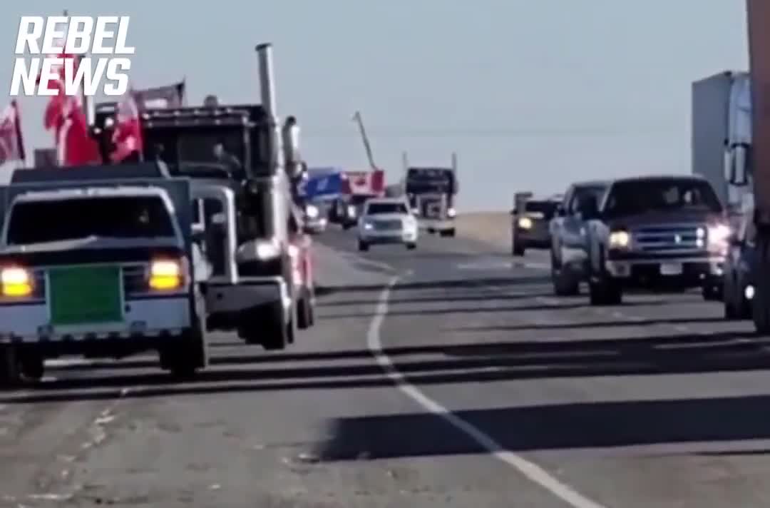 Trucks slowing traffic outside of Brooks Alberta in support of Coutts