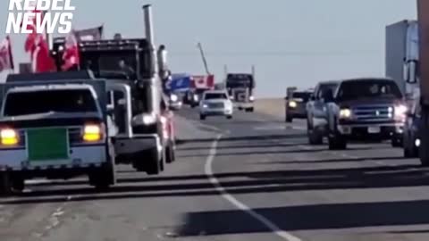 Trucks slowing traffic outside of Brooks Alberta in support of Coutts