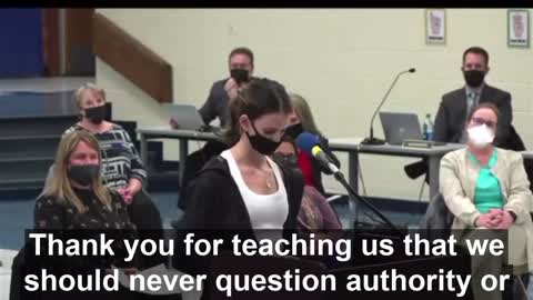 Young girl gets up Infront of the school board.