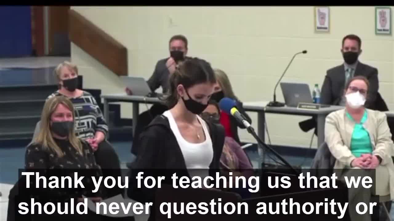 Young girl gets up Infront of the school board.