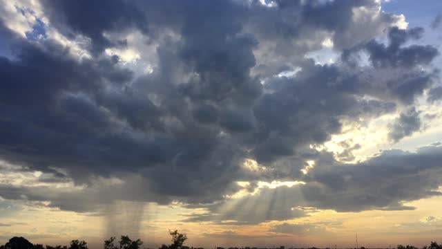 Beautiful Sky with sunshine & clouds moving across the Tennessee sky at sunset