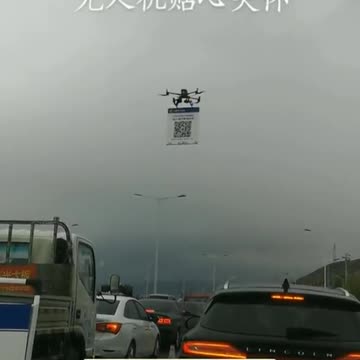 Chinese highway flying robot forces drivers to scan QR code Covid pass