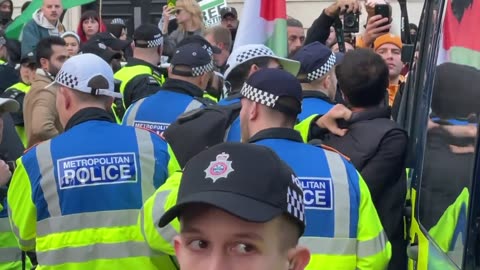 Police arrest a pro Palestine protester for a sign that said “bomb the House of Lords