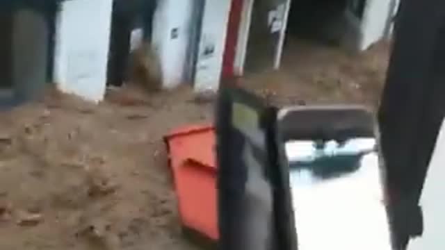 Floods in Germany, force of water drags everything through the streets.