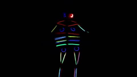 US woman puts her brilliant glow stick Halloween costume to use by dancing in the dark