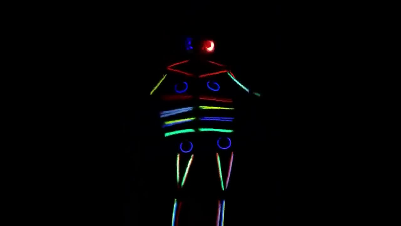 US woman puts her brilliant glow stick Halloween costume to use by dancing in the dark