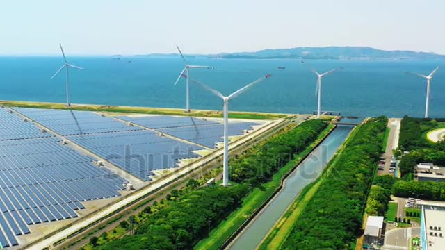 Solar power plant and Windmills aerial view. Renewable energy. Green tech.