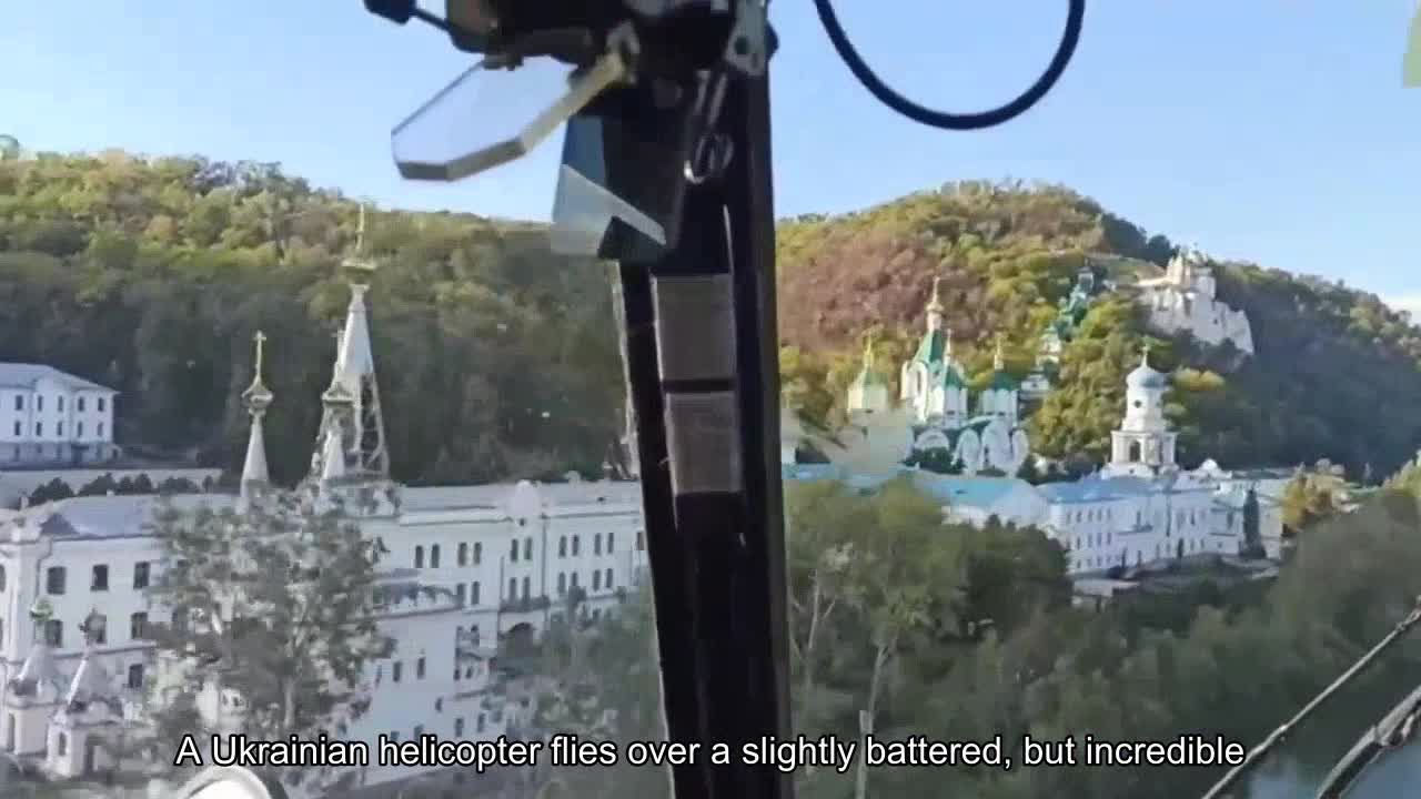 A Ukrainian helicopter flies over the slightly battered, but incredibly beautiful Lavra in the libe