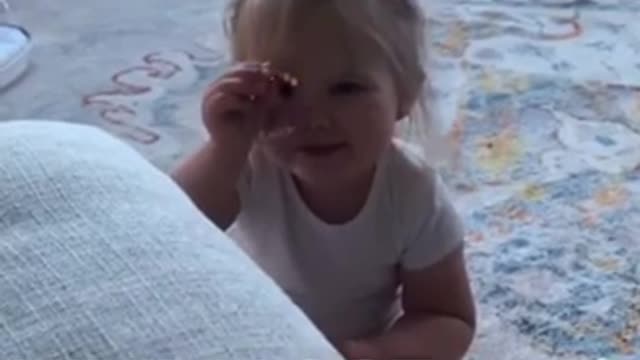 Toddler revealing secrets to her parents