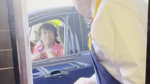 Trump created history. First US president working at McDonalds. Serves Indian couple at drive thru
