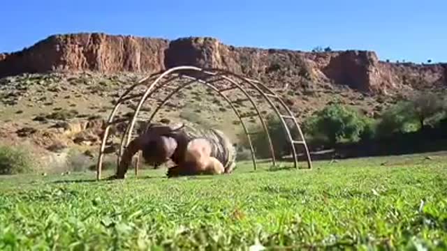 A young man doing amazing strength exercises