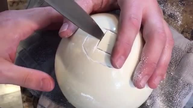 Guy cuts open ostrich egg and chugs/shotguns it in kitchen