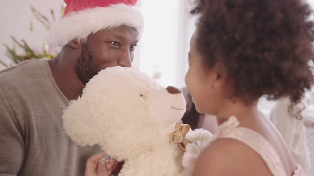 Dad Giving Her Daughter a Christmas Present