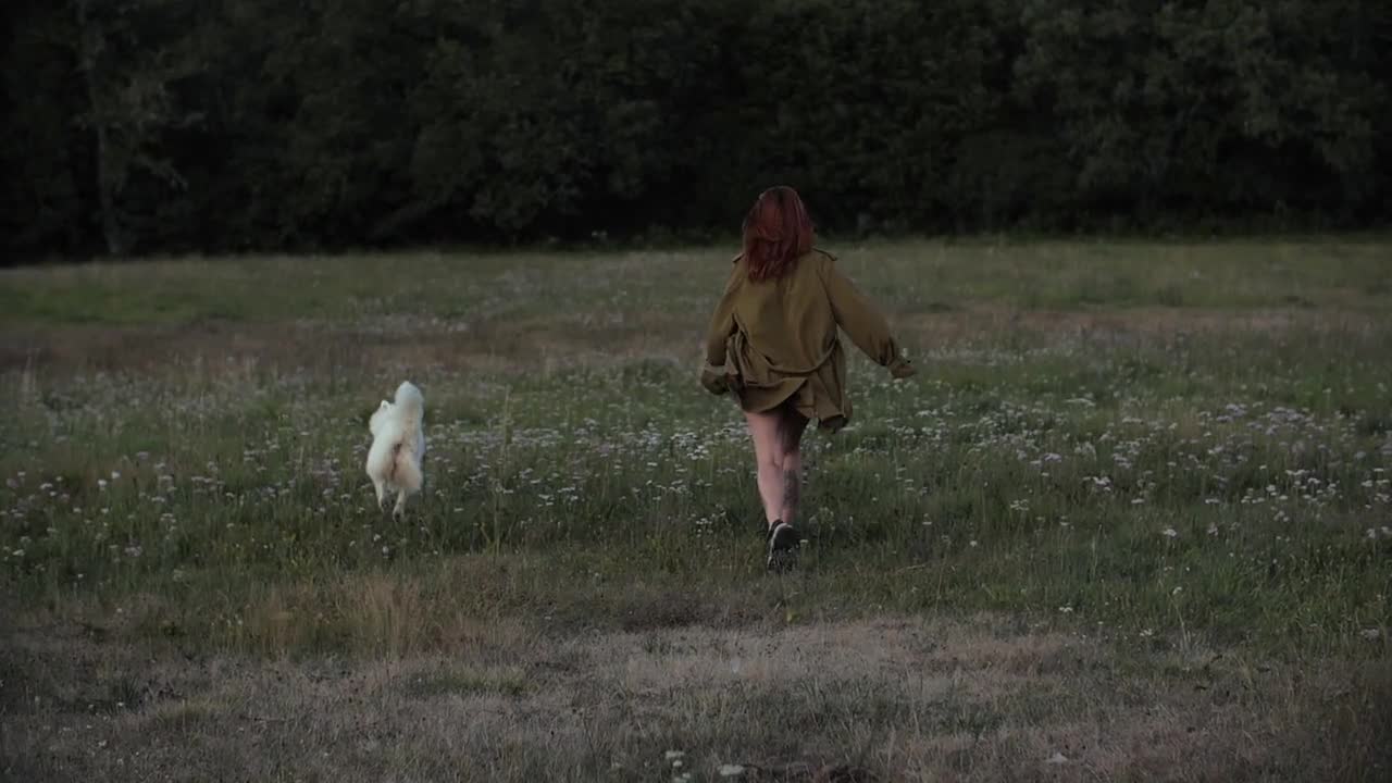 Woman Playing with Her Dog