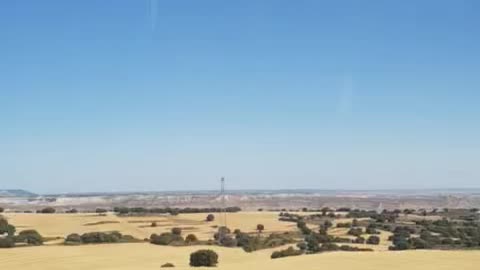 Outside view from a moving train to madrid