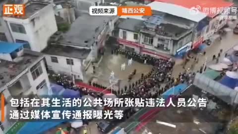 China - lockdown rule-breakers publicly shamed & paraded through the streets