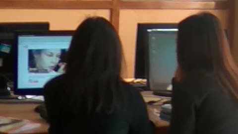 Girl watching makeup tutorial during class hour.