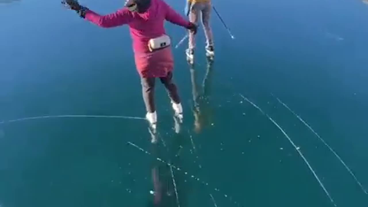 Skating over the clear glassy ice of rabbit lake in Canada