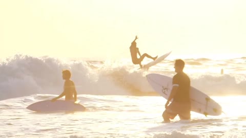 Surfing on the beach on a hot day is really thrilling