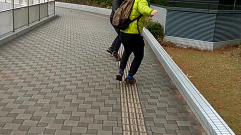 2 GROWN MEN FIGHTING WITH STICKS IN JAPAN