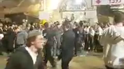 Terrorists in uniform beating the hell out of a Jew at Meron