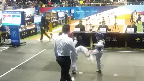 children competing in taekwondo