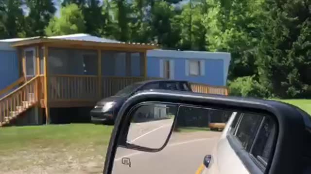 Guy drives through trailer park and sees giant leg sculptures heels wooden