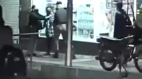 Iran A soldier sees a woman with uncovered hair in the street