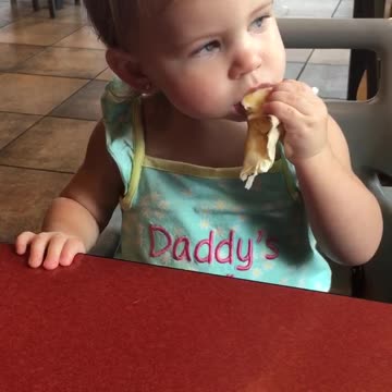 Baby loves burrito so much she starts dancing!