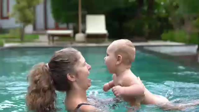 Mother and child baby enjoy water and food
