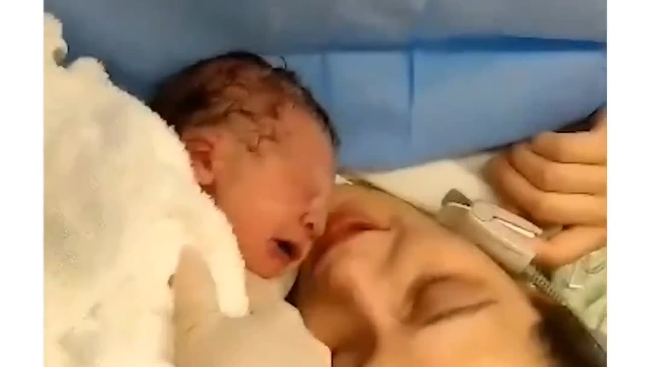 New born baby reacting to mom's kiss....