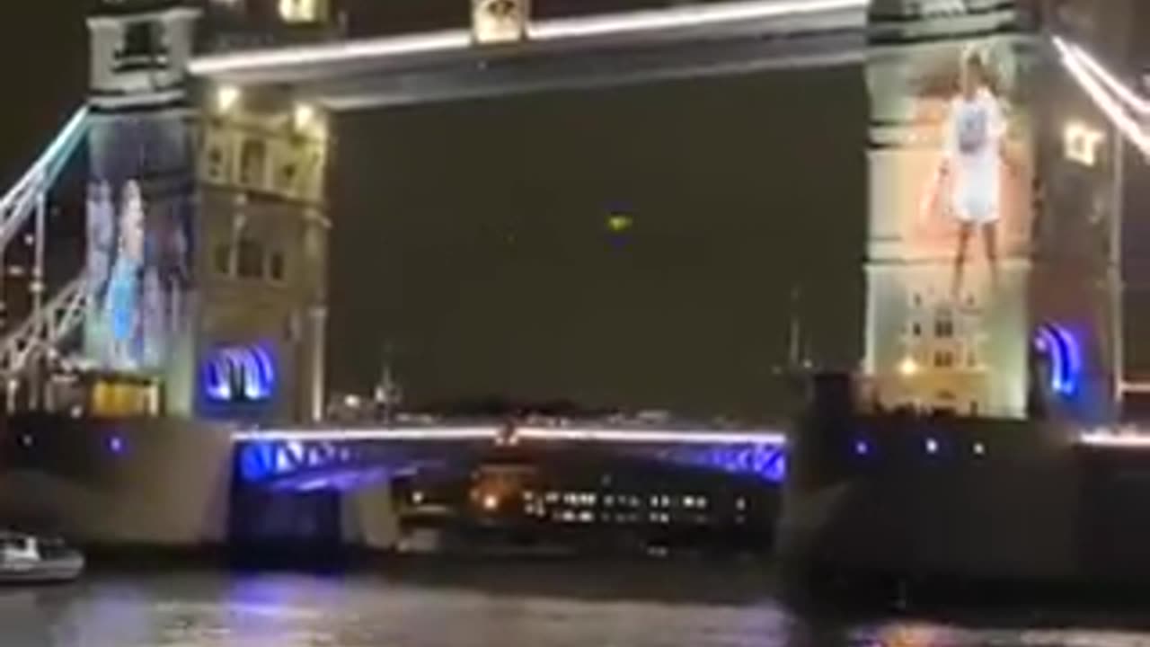 Roger Federer Playing Tennis With A Younger Version Of Himself On Tower Bridge In London