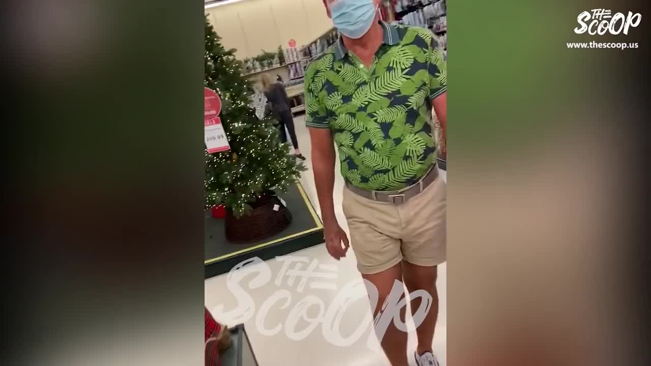 Man aggressively tells woman to put a mask on.