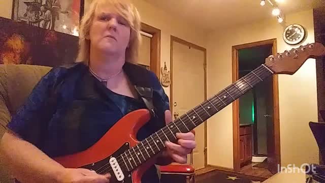 Cari Dell- female lead guitarist jamming to the blues