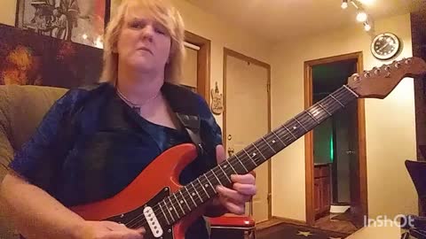 Cari Dell- female lead guitarist jamming to the blues