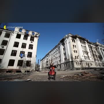 A man is playing a cello in the Kharkiv,city center,Ukraine